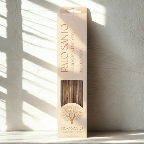 Palo Santo Incense Sticks - Pack Of 30, box standing against a light wall with dramatic shadow lines.